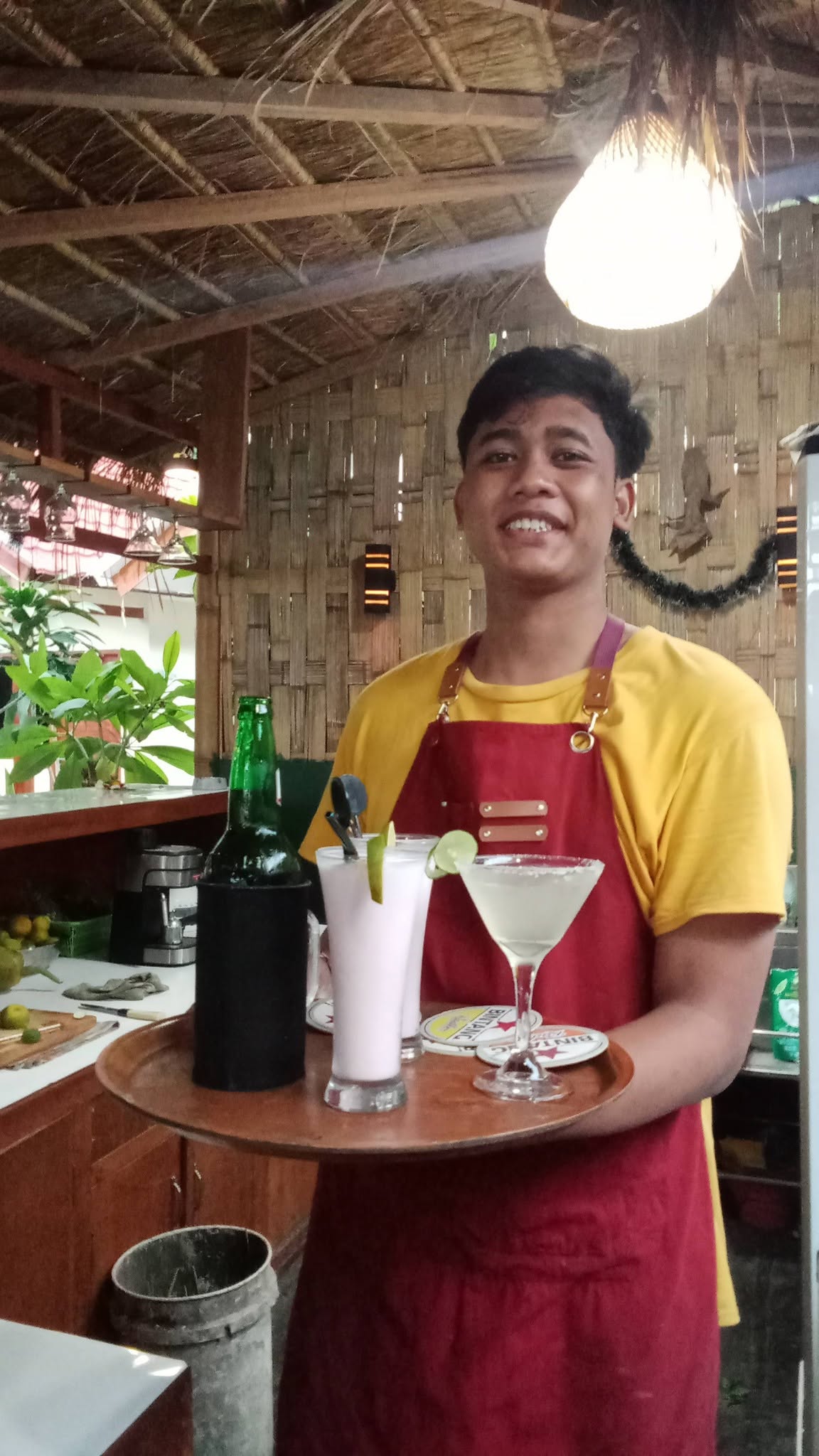 Friendly Bartender Serving Drinks